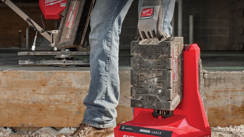 A Milwaukee Red Lithium Forge battery being used with a super charger