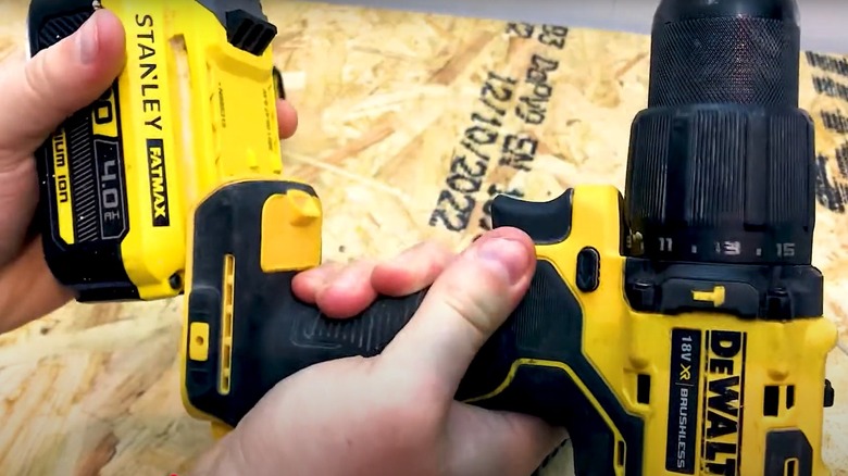 Person trying to use a Fat Max battery on a DeWalt drill