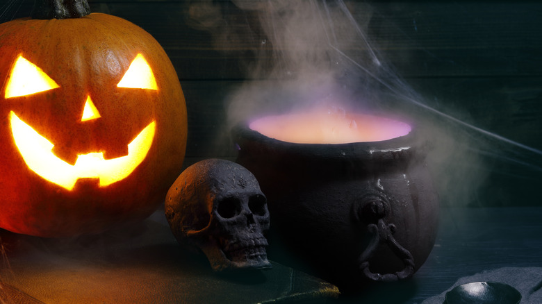 Jack-o-lantern with cauldron decoration
