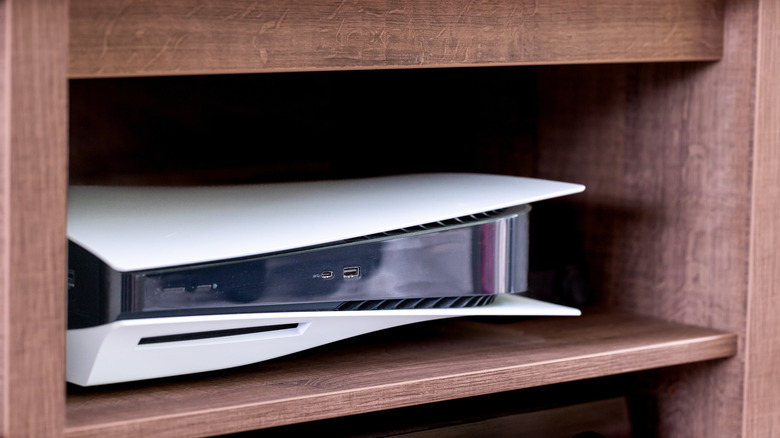 A PlayStation 5 nestled inside of a media console