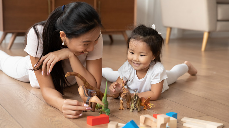 Mother and child with toys