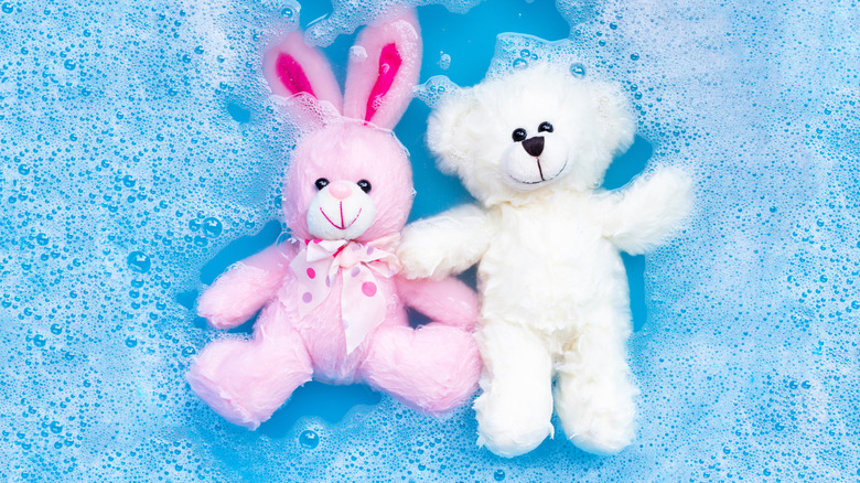 stuffed animals in soapy water