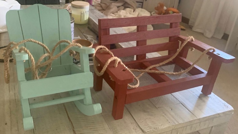 Bird feeders shaped like a rocking chair and a bench