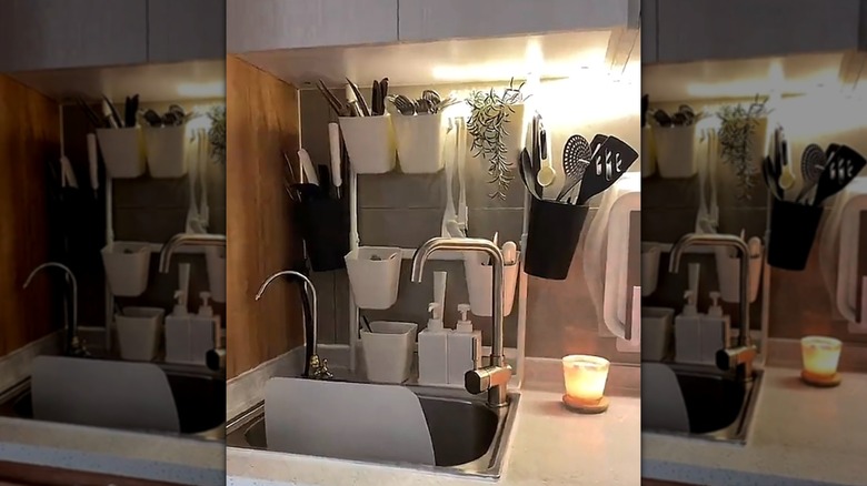 SUNNERSTA kitchen organizer rack from IKEA displayed in a kitchen with utensils and plant.