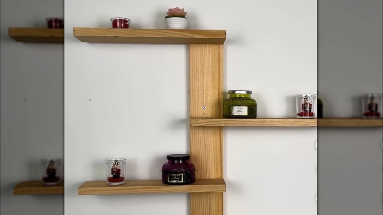 DIY spine floating shelf made from wood boards with minimal decor