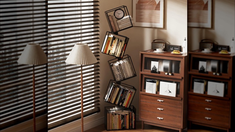 Metal Geometric Bookshelf styled in a home next to a lamp, window and cabinet.