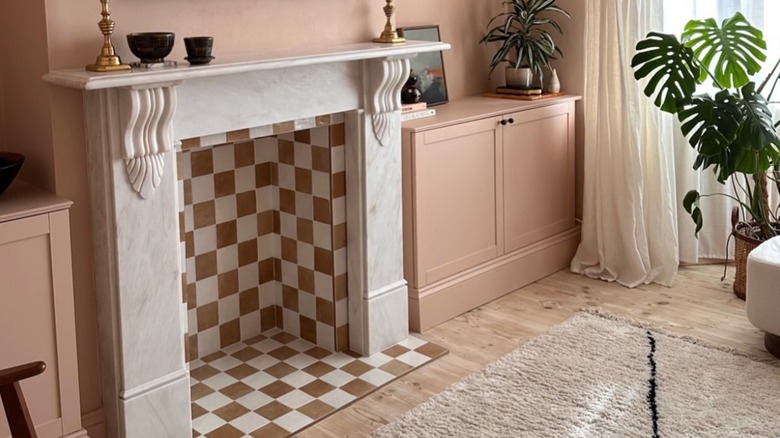 Checkered tile fireplace with white marble mantle in living room