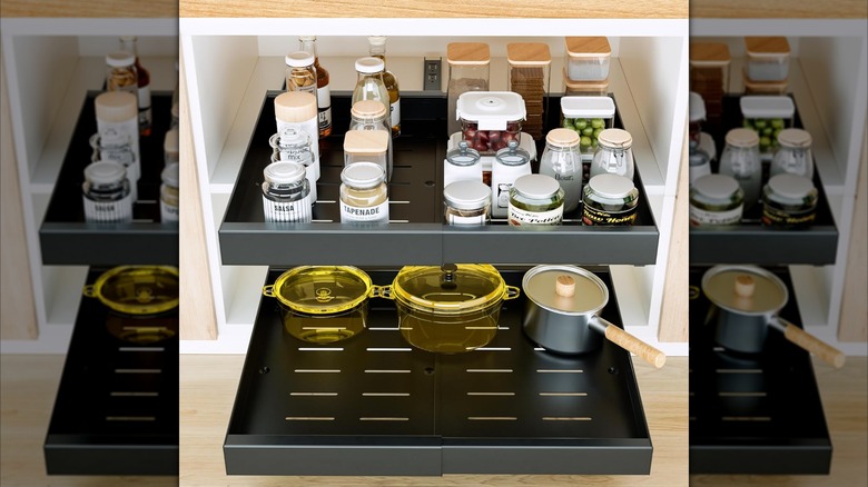 Expandable slide out drawers with pots and bottles of spices