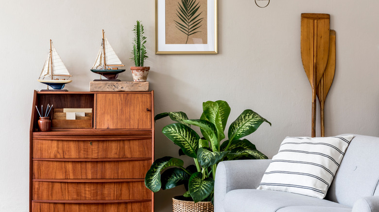 Shelf and chair with maritime decor and oars