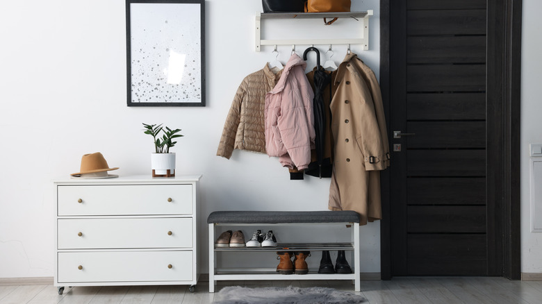 Entryway bench with coats and shoes