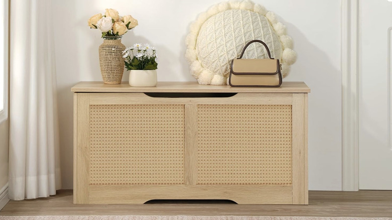 Rattan-like storage bench in an entryway