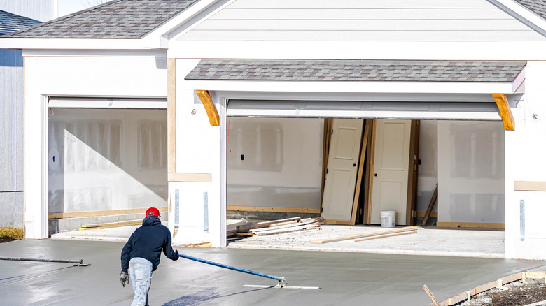 A man installing a concrete driveway