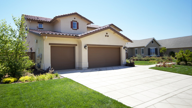 An attractive home with a driveway made from concrete pavers