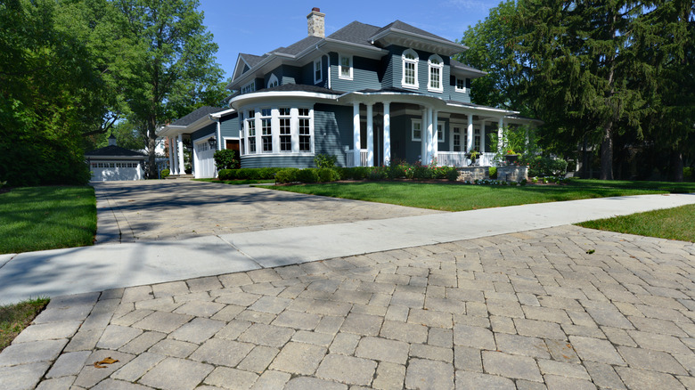 An attractive home with a permeable cobblestone driveway