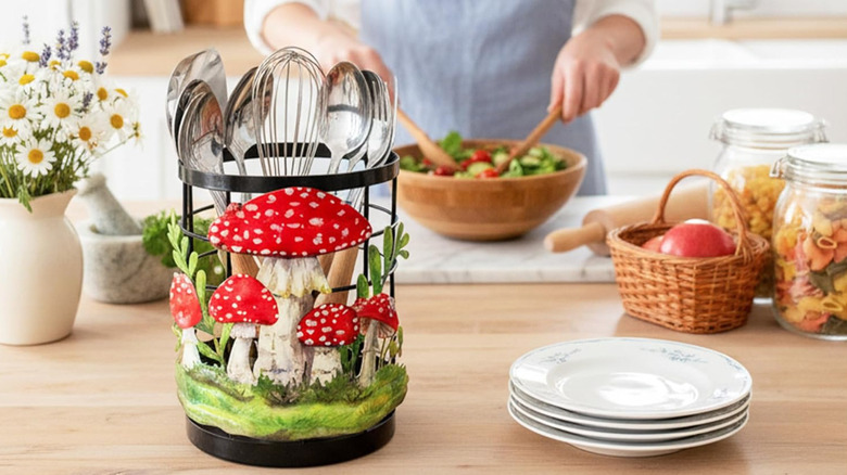 mushroom-themed kitchen utensil holder on counter