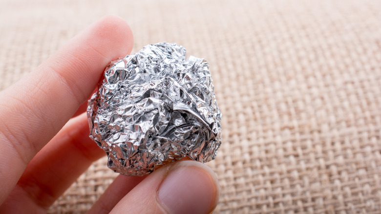 A crumpled up aluminum ball