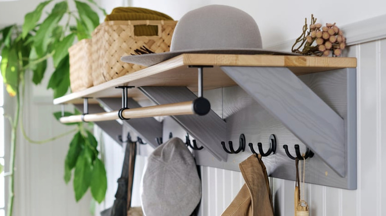 IKEA KALLSÖ in entryway holding coats and baskets