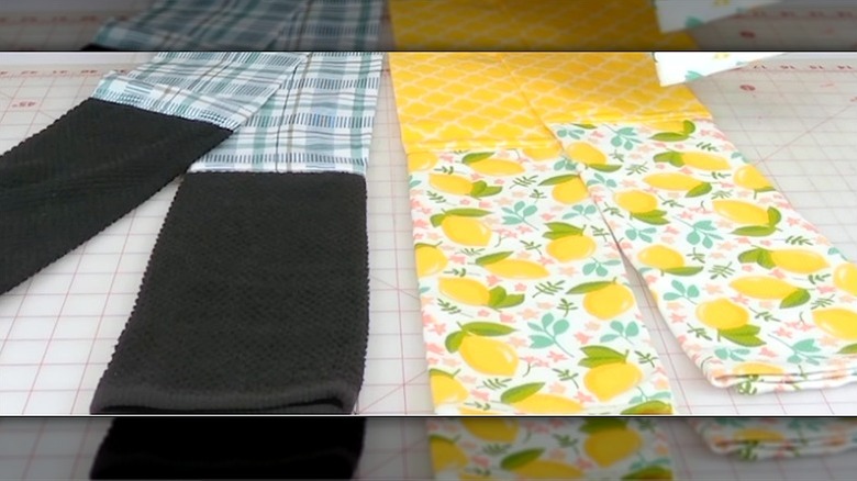 Two finished towel boas lie on a countertop, ready to use.
