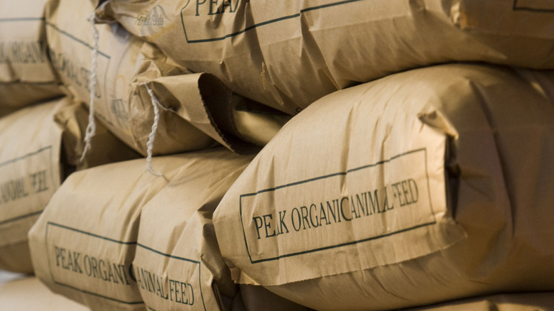 Stacked farm animal feeds in bags