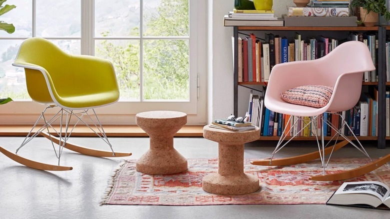 Two cork stools and two rocking chairs in reading area