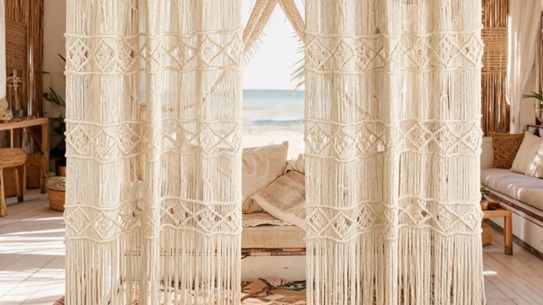 Two macrame curtain panels on display outdoors