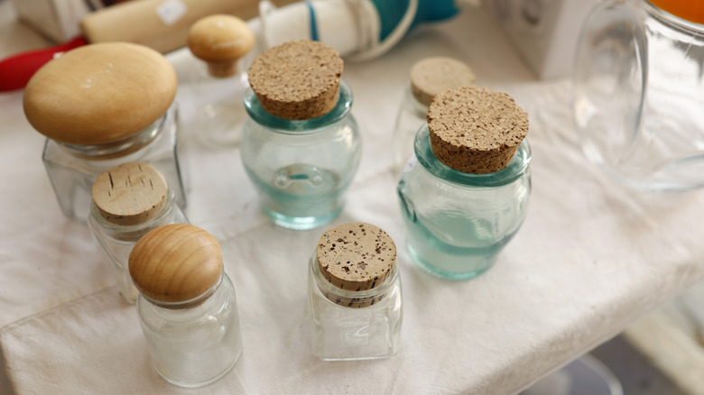 Vintage glass jars with cork and wood stoppers