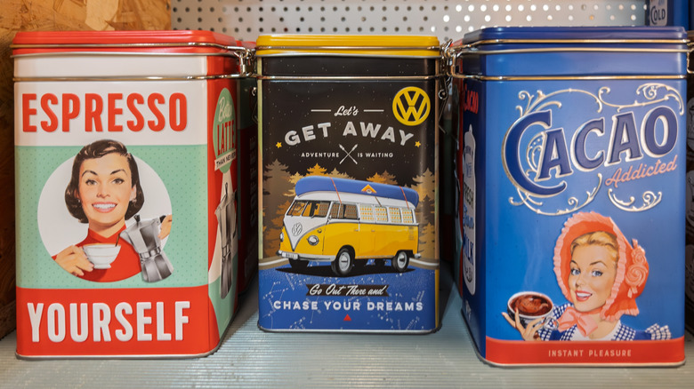 A trio of vintage food tins on display on a shelf