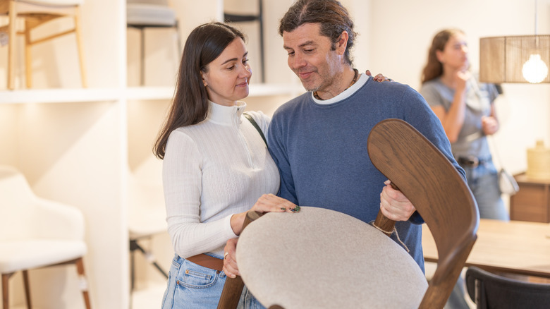 Young couple buying liquid wood chair