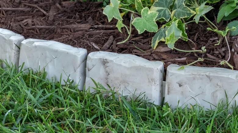 Budget-friendly faux stone landscape edging can look just like real stone