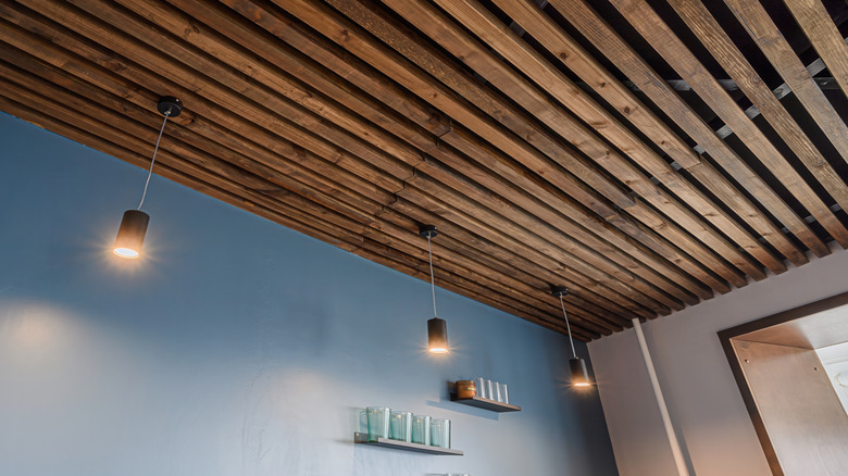 Blue room with wood slat ceiling