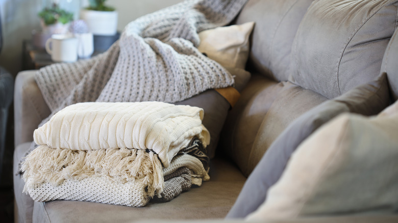 Blankets folded on a couch