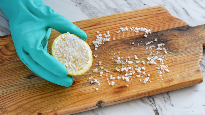 Lemon and salt on a cutting board