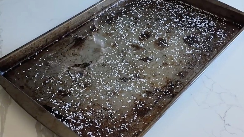 Baking sheet covered in salt and vinegar