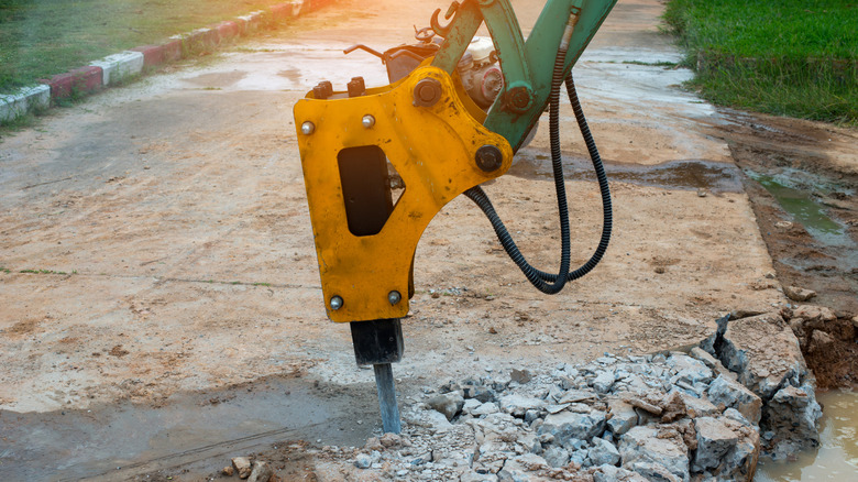 Jackhammer breaking up a concrete driveway