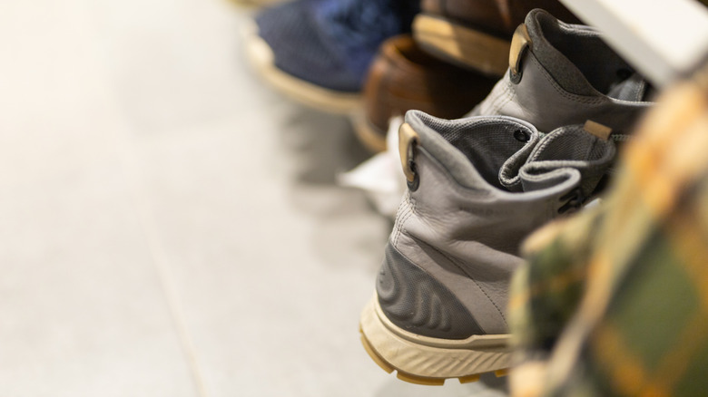 Cluttered shoes in a home's entryway.