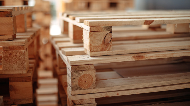 An up-close shot of wood pallets stacked on top of each other.
