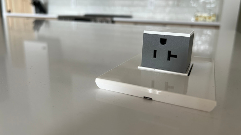 A pop-up outlet on a kitchen countertop