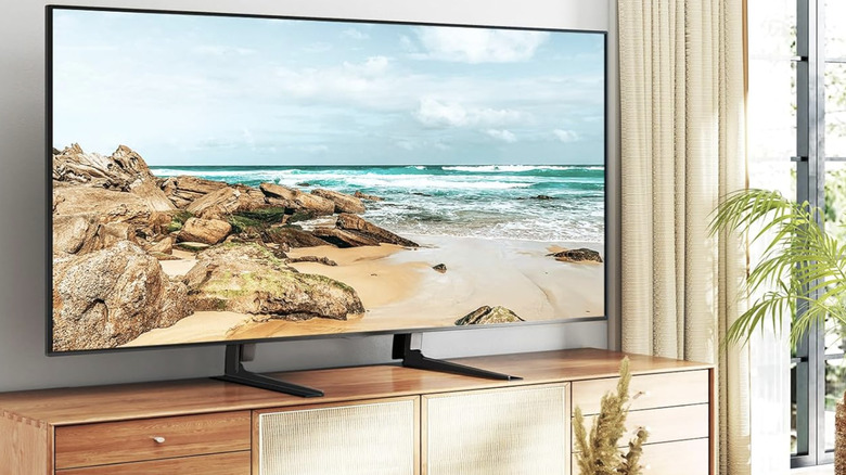 Product image of 5Rcom on Amazon: Plasma TV attached to a universal TV stand sitting on top of TV console