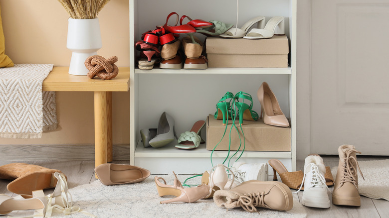 Messy shoes all over the floor.