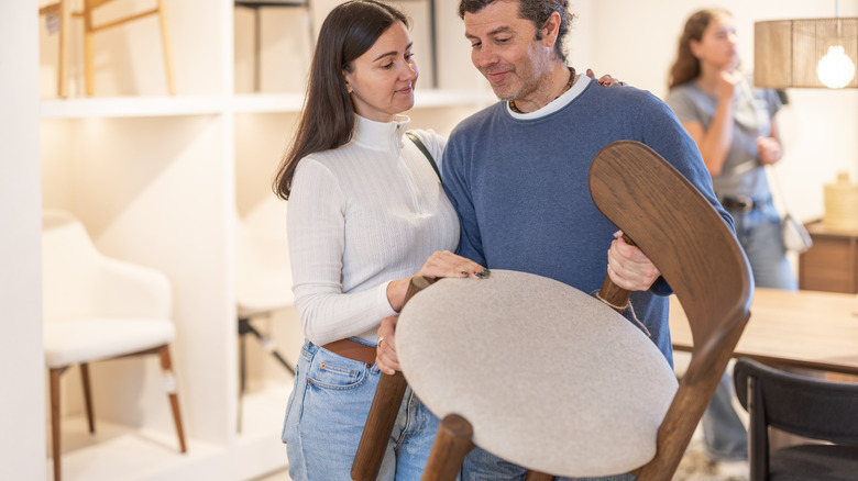 Young couple buying liquid wood chair