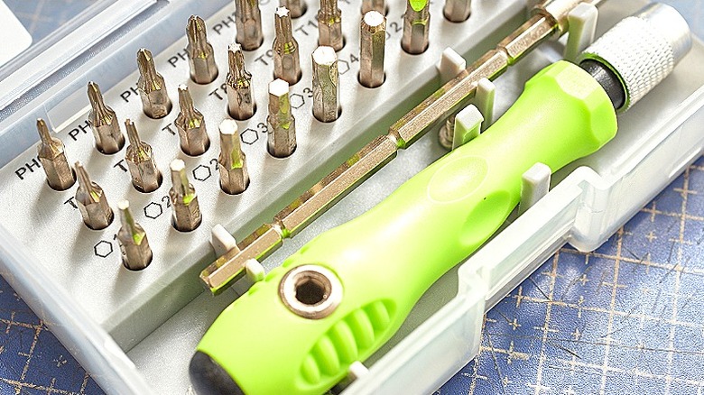 Close-up of a ratcheting screwdriver kit with multiple bits