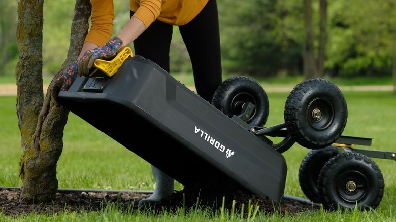 Person emptying a Gorilla Carts cart