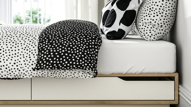 IKEA MANDAL Bed frame with storage in a brightly lit room
