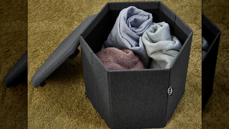 IKEA KJUGE holding a few blankets inside