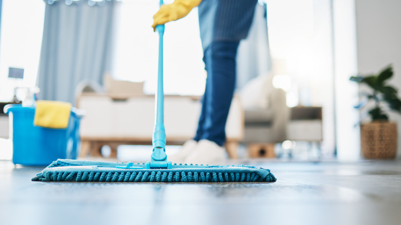 Person cleaning floor