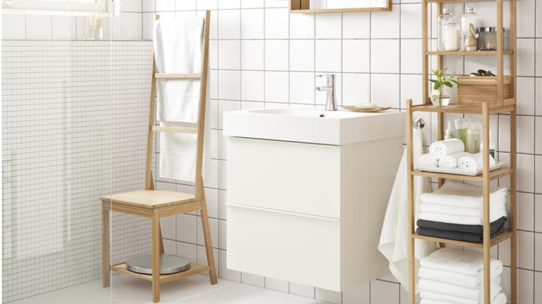 IKEA chair with towel rack in brightly lit bathroom