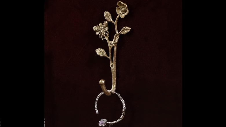 Brass hooks with intricate metalwork detailing