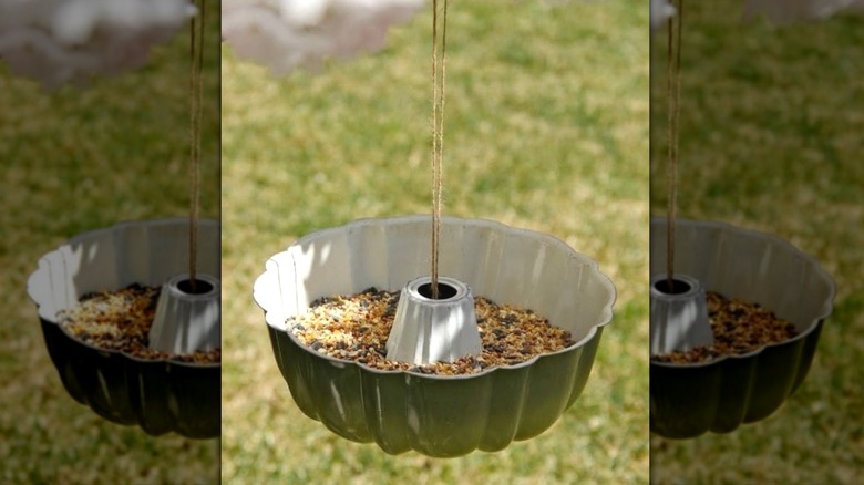 Hanging bird feeder made from upcycled bundt pan.