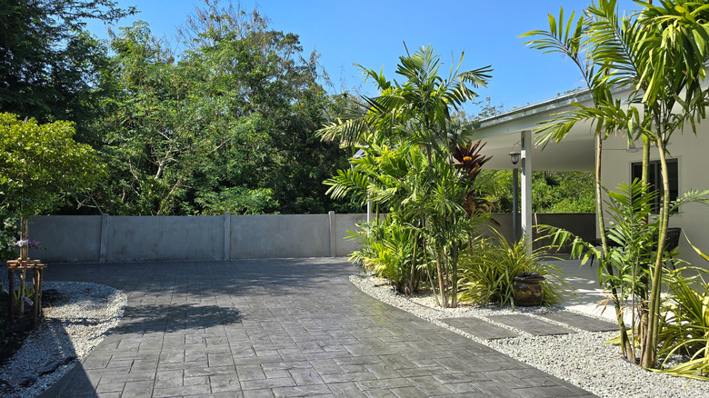 A modern home with a stamped concrete driveway