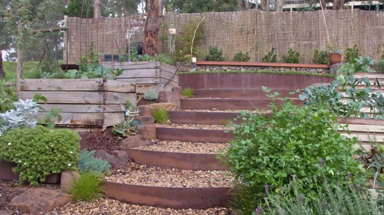 Garden steps made out of corten steel panels.
